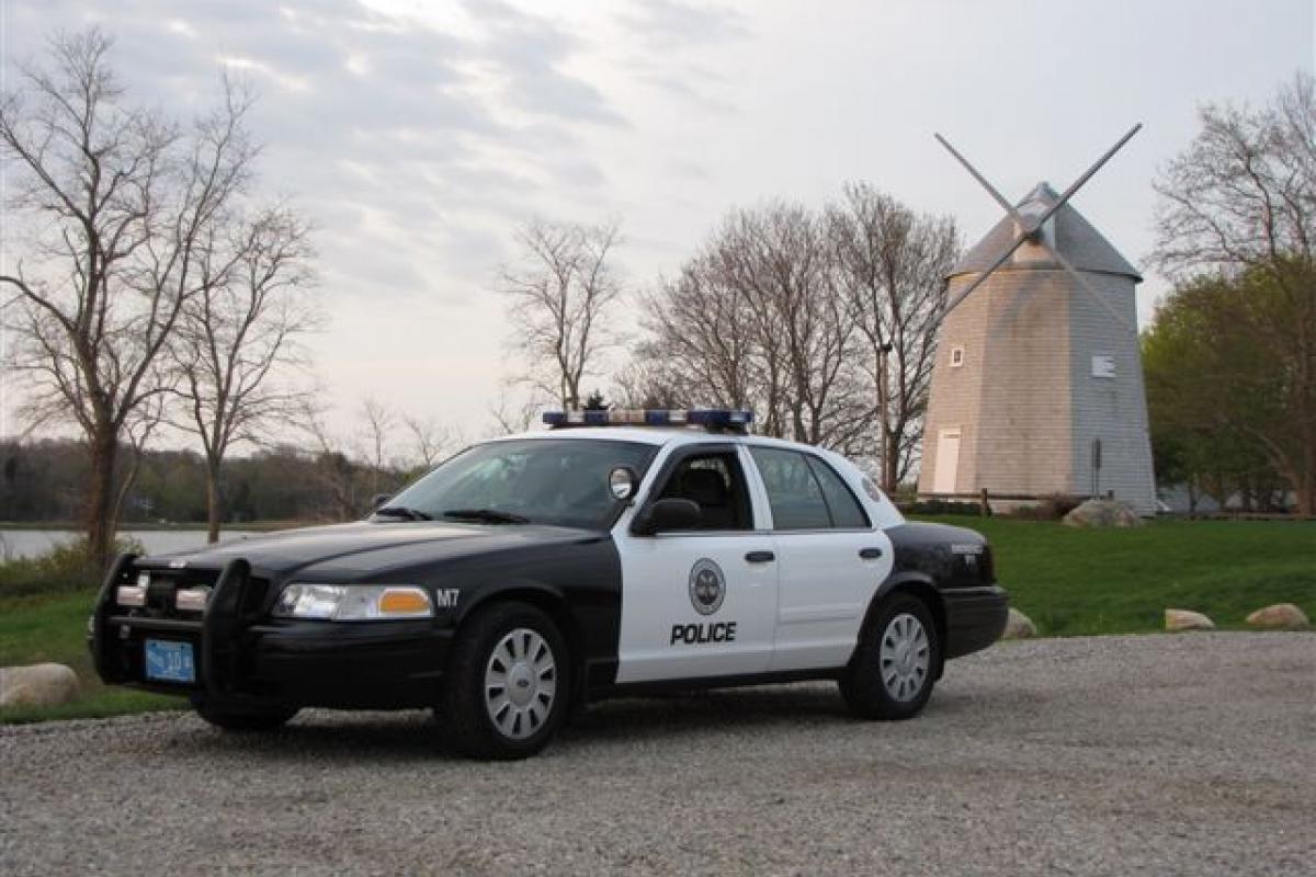 Old M7 vehicle by windmill