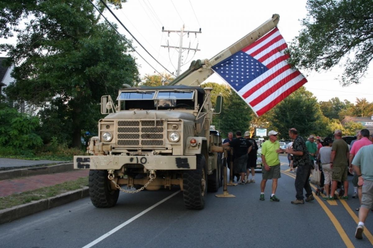 A military vehicle with a flag