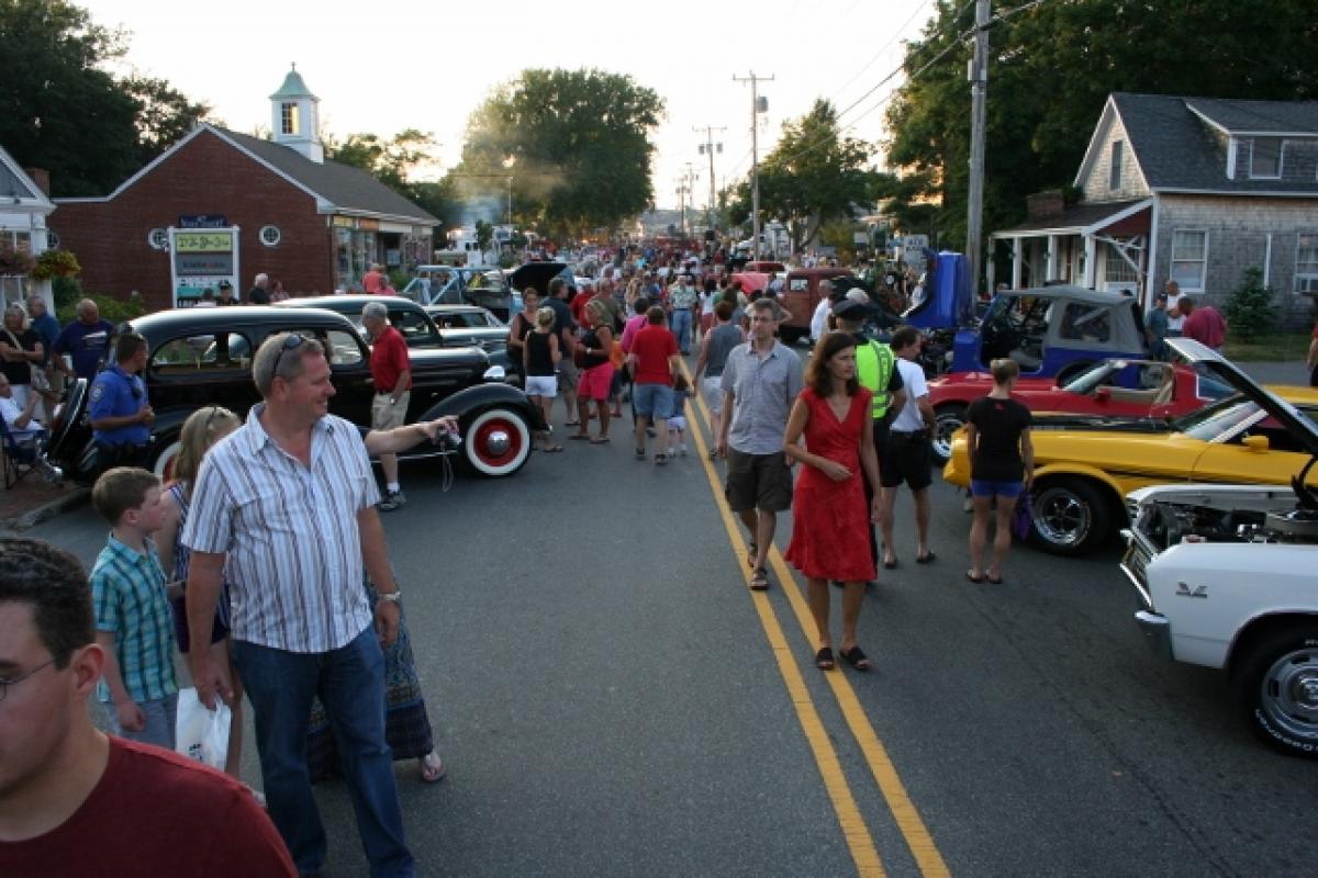 People viewing antique cars