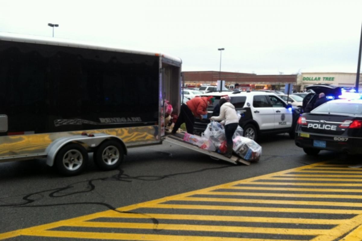 Loading bags of toys into a trailer