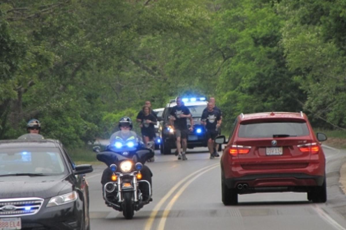 Officers running with police escort 2